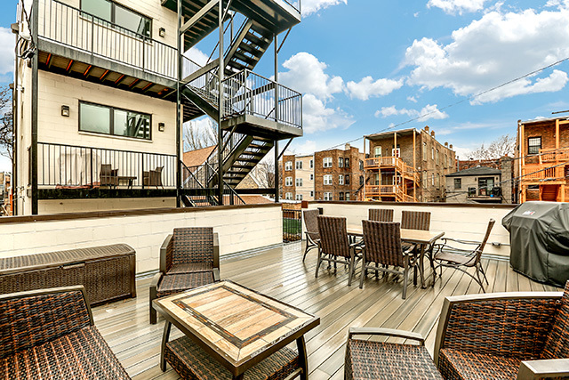 2042 West Rice Street, Unit 1 Chicago, IL 60622 - Photo 25 of 27 a view of a patio with dining table and chairs