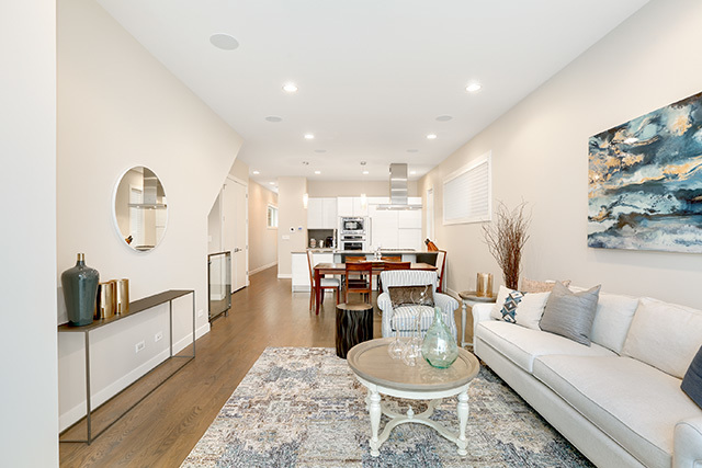 2042 West Rice Street, Unit 1 Chicago, IL 60622 - Photo 5 of 27 a living room with furniture kitchen view and a wooden floor