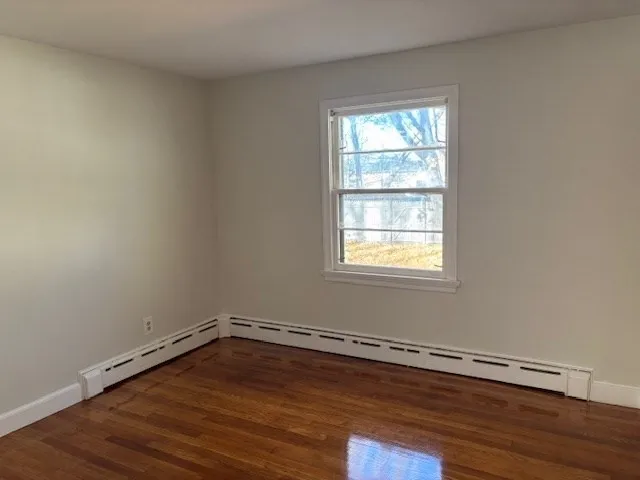 a room with window and wooden floor