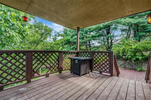 a view of outdoor space with wooden floor