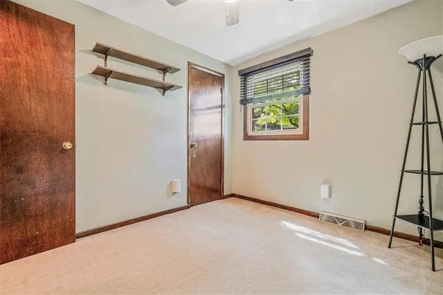 a view of an empty room with windows