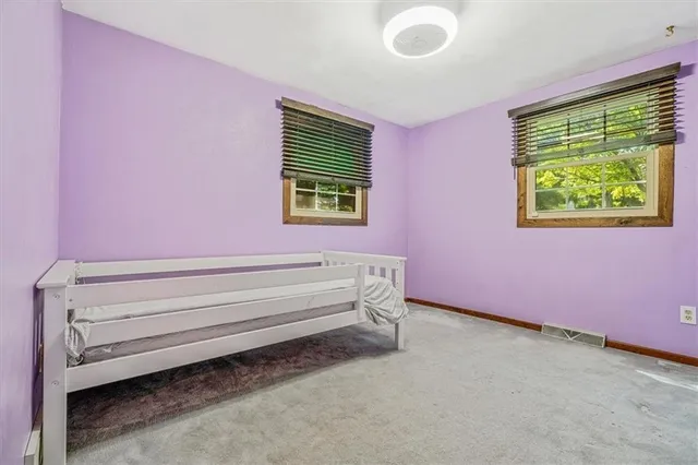 a view of room with hardwood floor and window