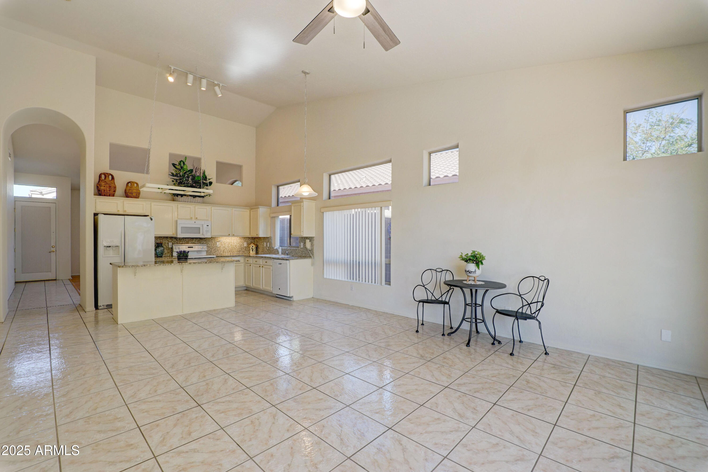3055 North Red Mountain, Unit 74 Mesa, AZ 85207 - Photo 14 of 38 a view of kitchen with furniture and refrigerator