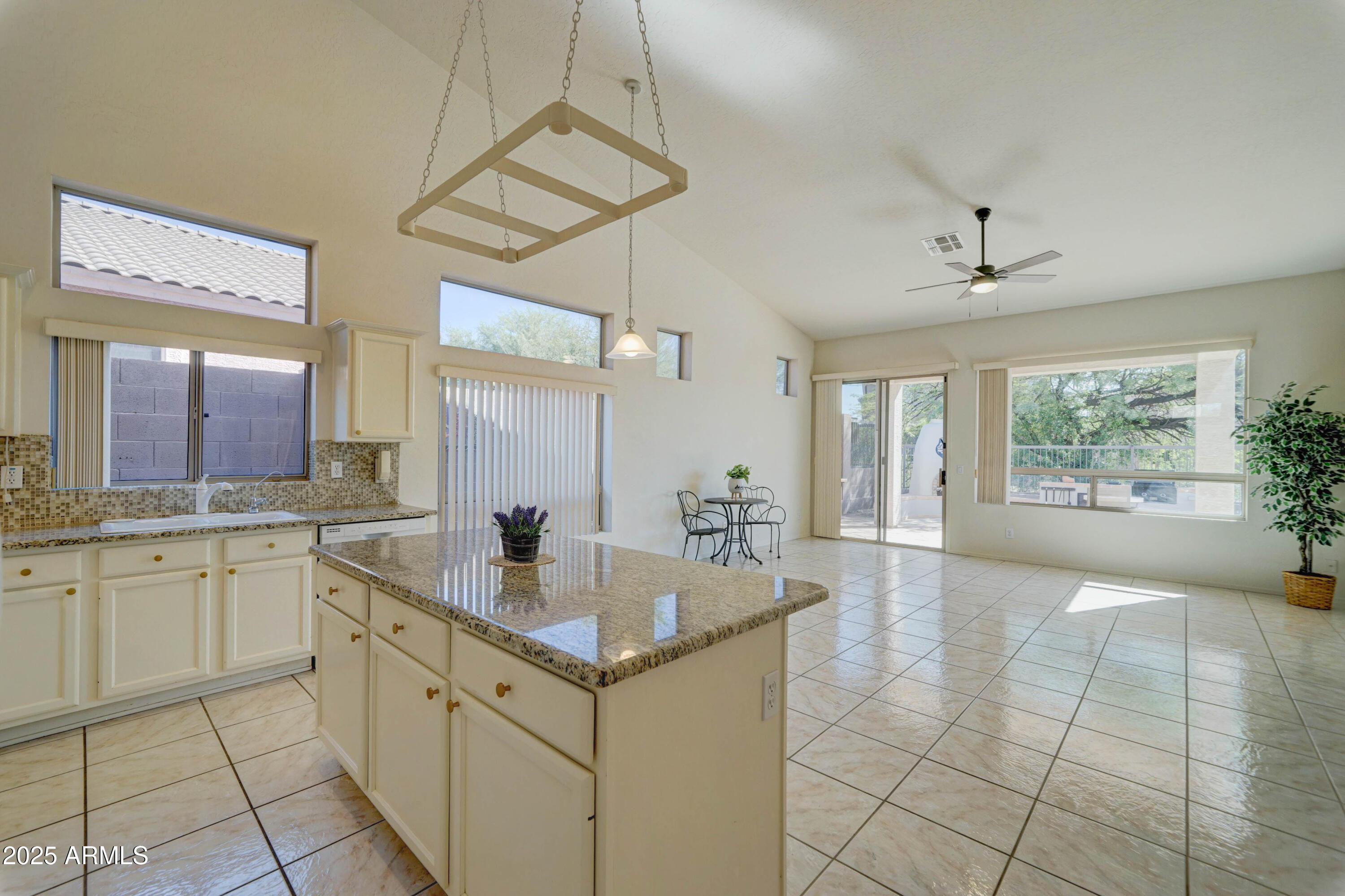 3055 North Red Mountain, Unit 74 Mesa, AZ 85207 - Photo 18 of 38 a large white kitchen with a large window