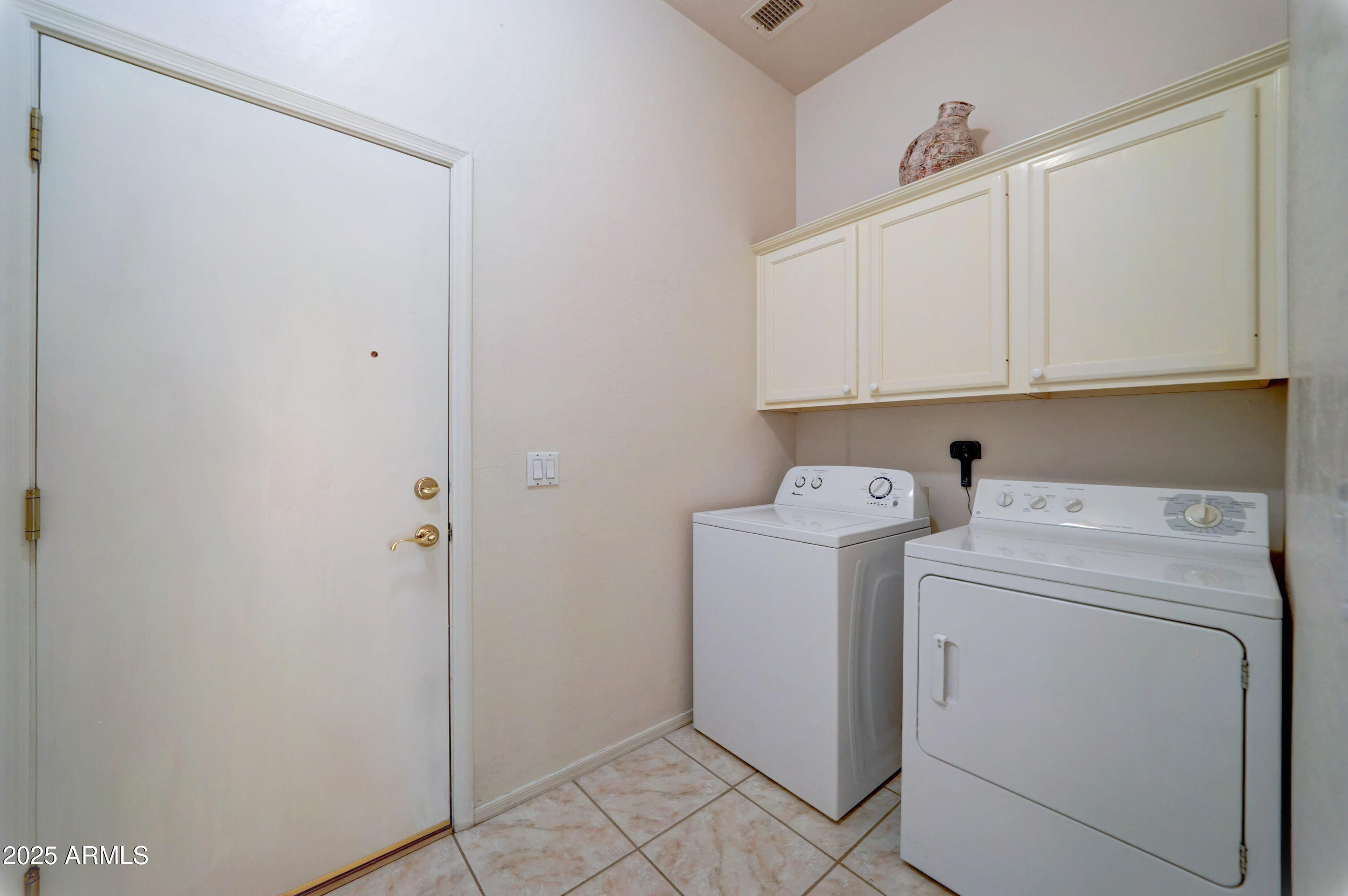 3055 North Red Mountain, Unit 74 Mesa, AZ 85207 - Photo 33 of 38 a view of storage and utility room with washer and dryer