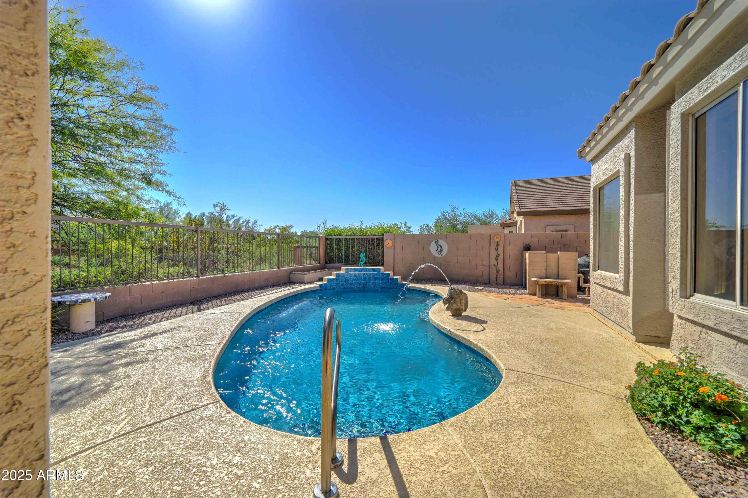 3055 North Red Mountain, Unit 74 Mesa, AZ 85207 - Photo 37 of 38 a view of a swimming pool with a patio