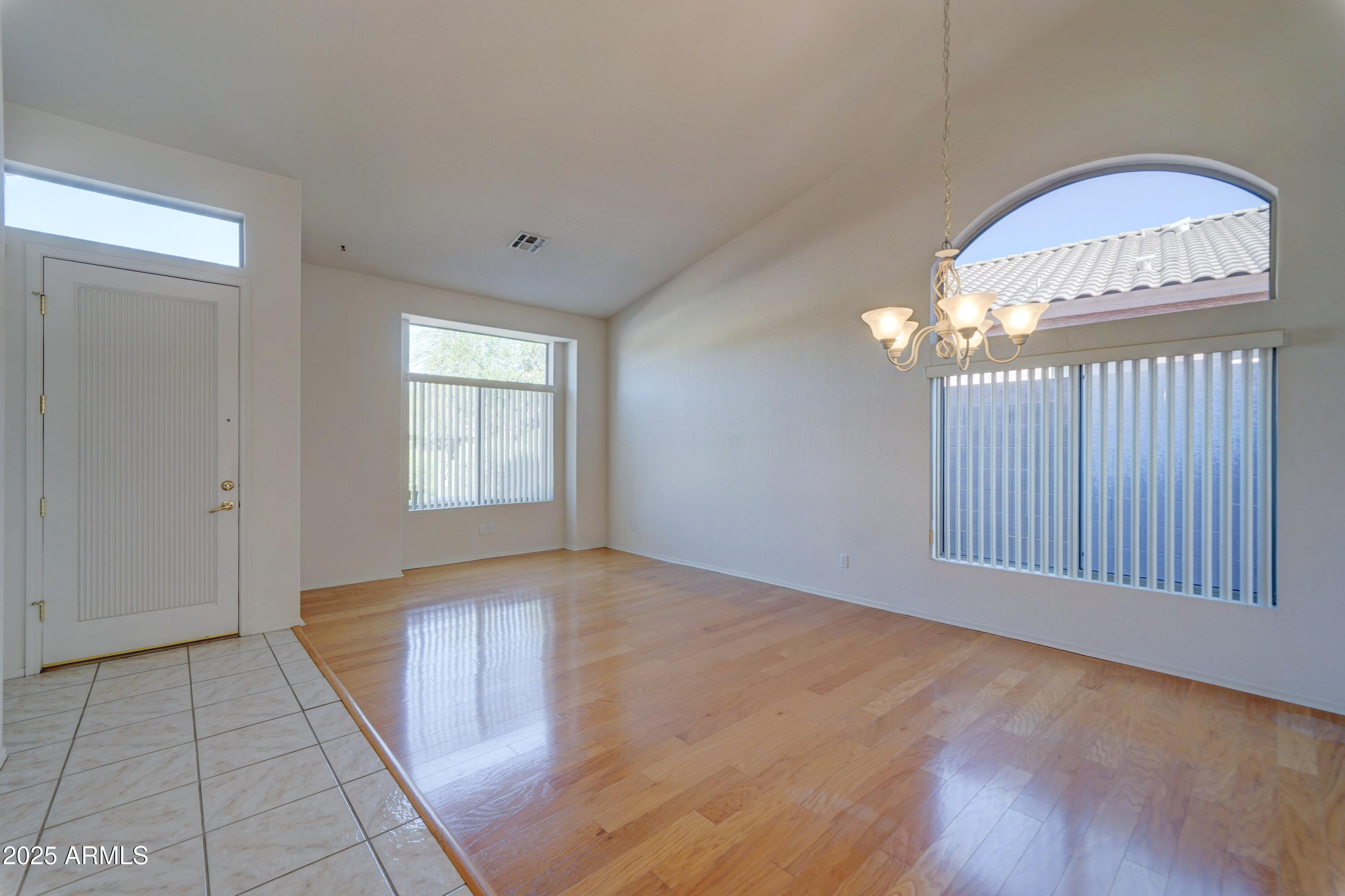 3055 North Red Mountain, Unit 74 Mesa, AZ 85207 - Photo 7 of 38 a view of an empty room with a window