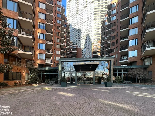 a view of a building and a people on a street