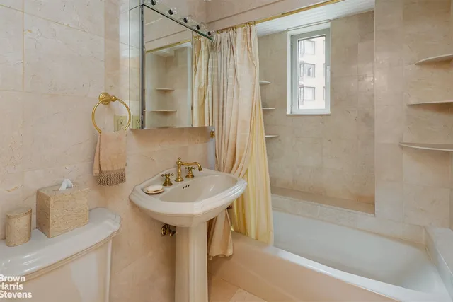 a bathroom with a sink a mirror and a bathtub