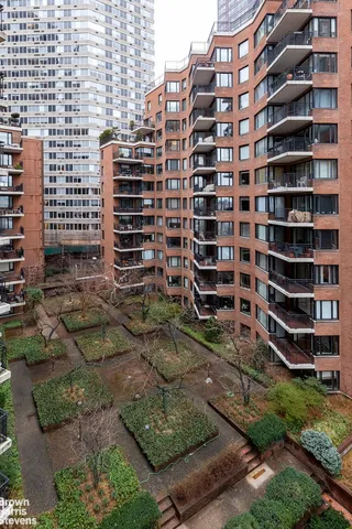 a view of a building with a yard