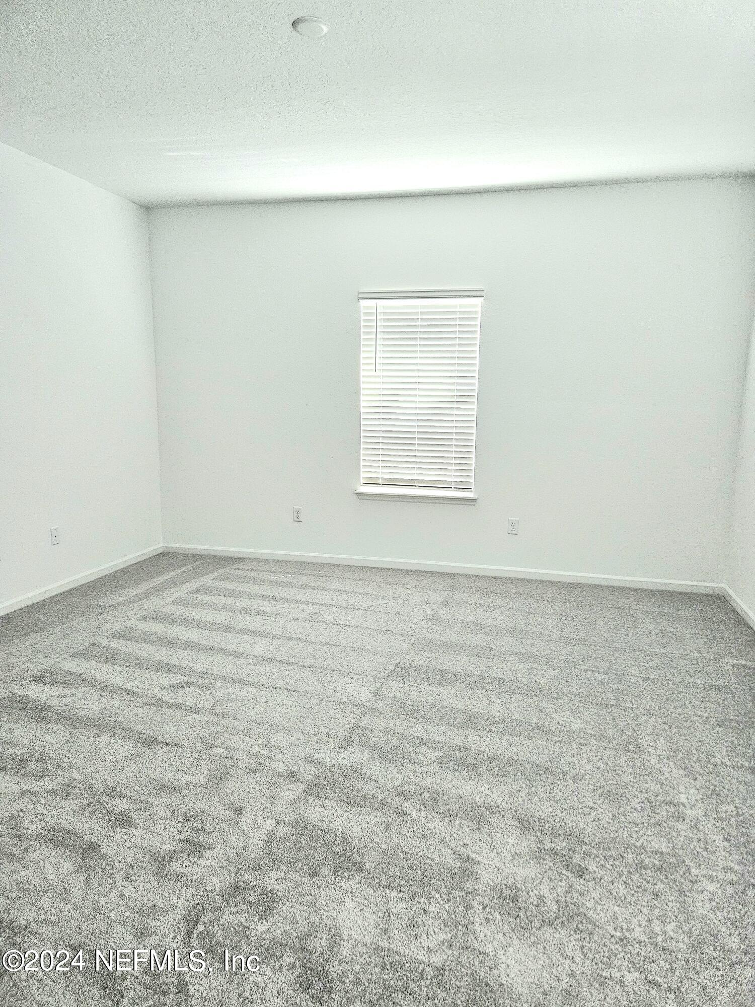 49 Blue Cypress Trail St. Augustine, FL 32084 - Photo 12 of 23 an empty room with a window