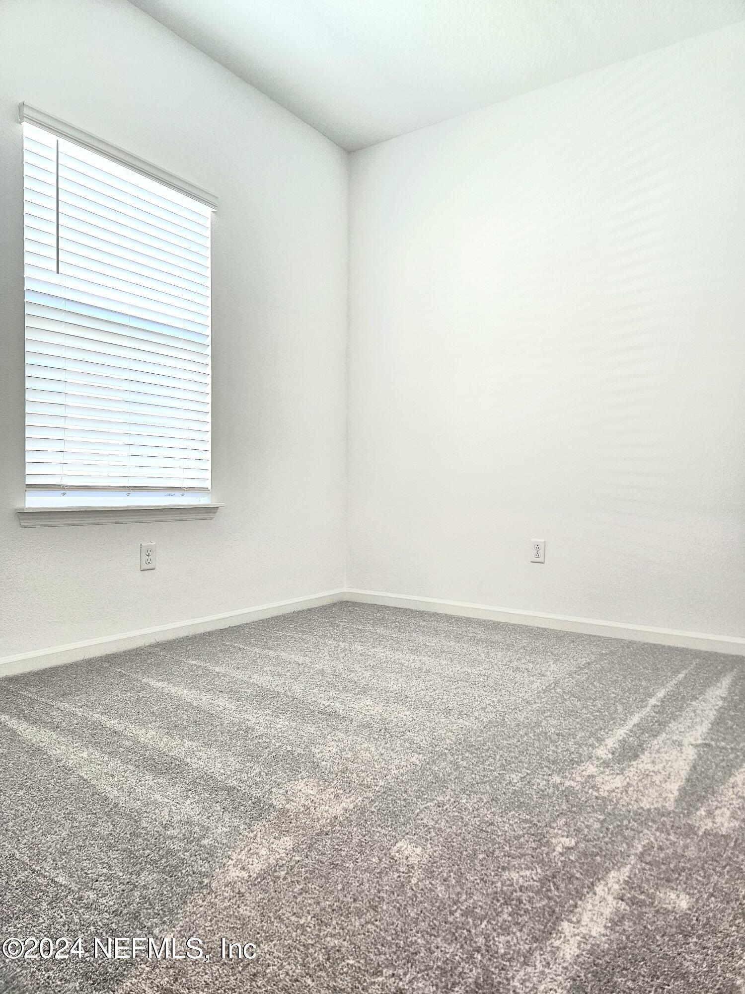 49 Blue Cypress Trail St. Augustine, FL 32084 - Photo 13 of 23 an empty room with a window