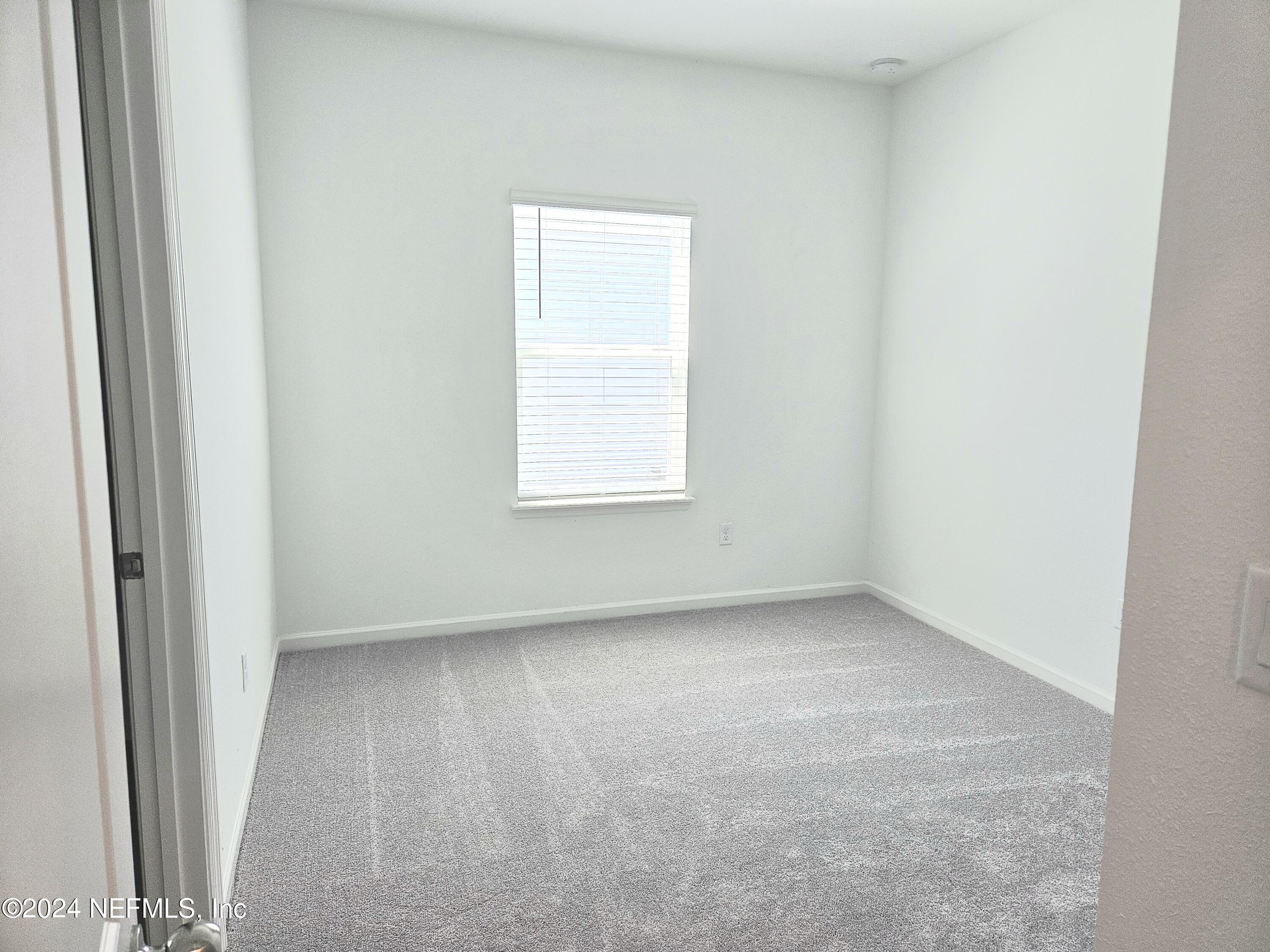 49 Blue Cypress Trail St. Augustine, FL 32084 - Photo 14 of 23 an empty room with a window