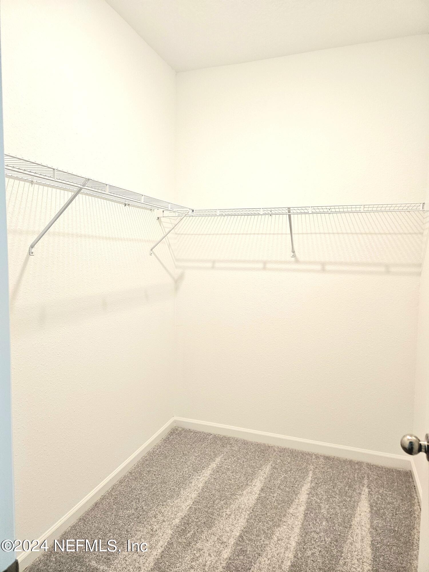 49 Blue Cypress Trail St. Augustine, FL 32084 - Photo 16 of 23 a view of small space with wooden floor