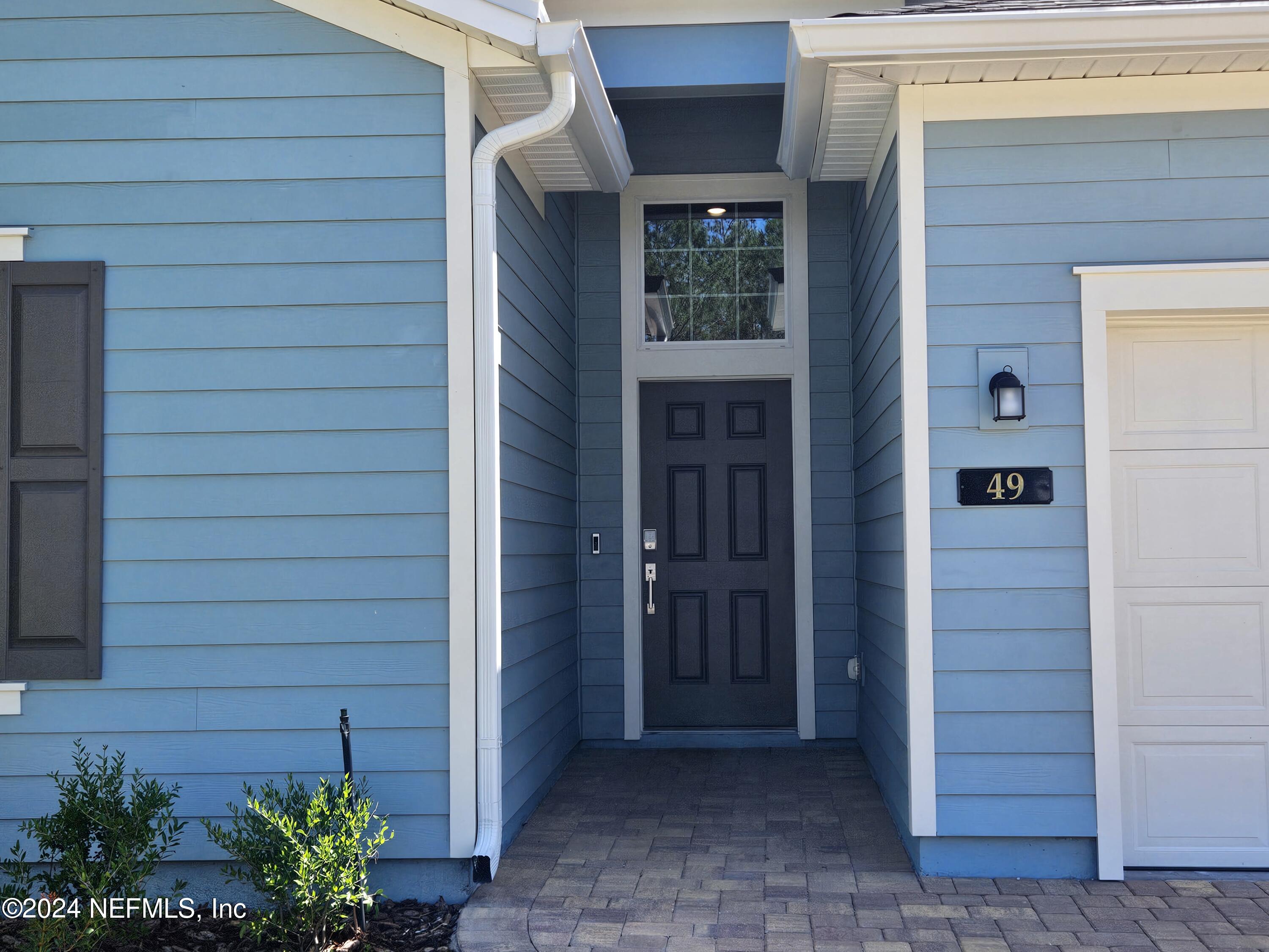 49 Blue Cypress Trail St. Augustine, FL 32084 - Photo 3 of 23 a view of front door of house and yard