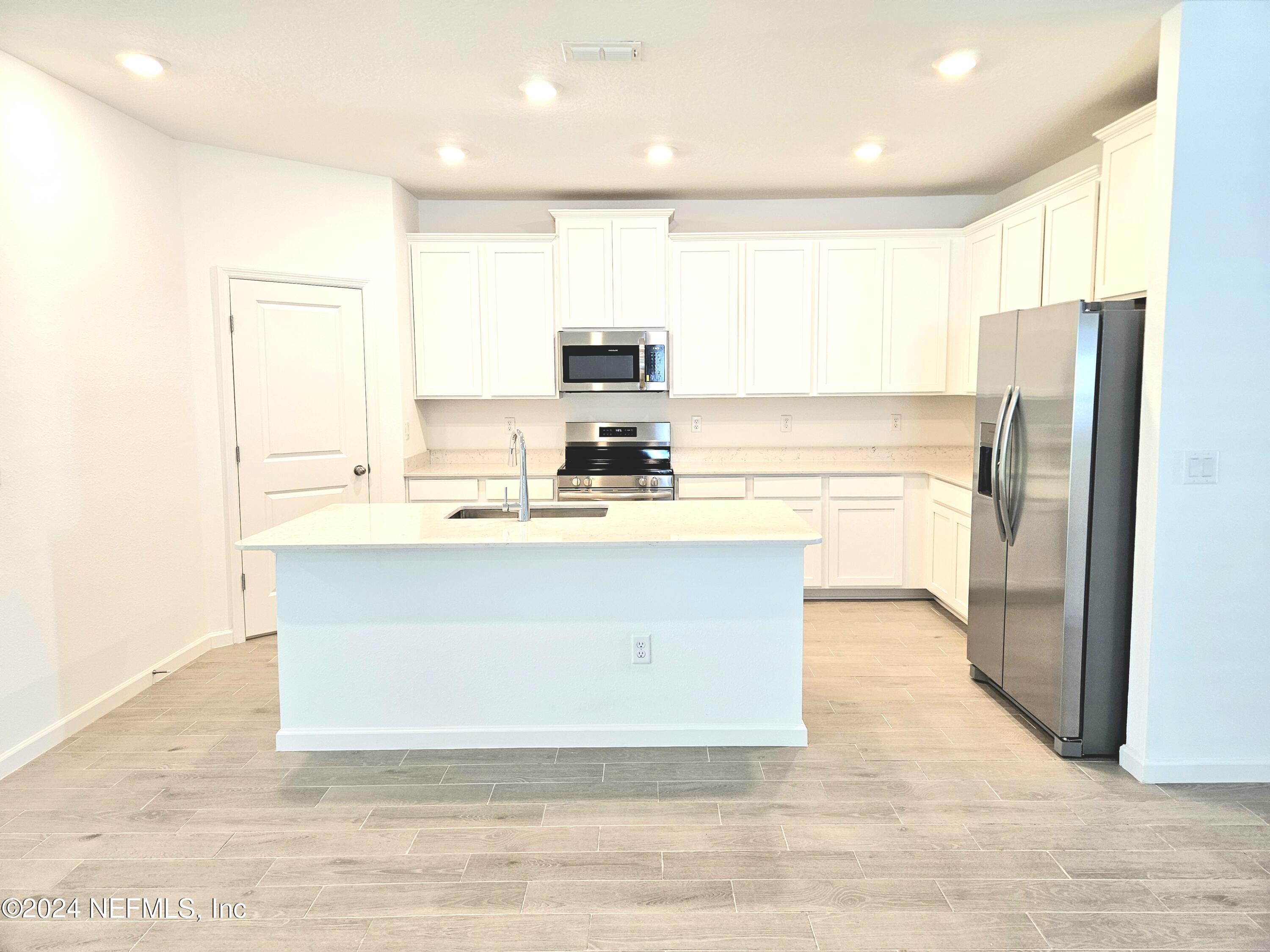 49 Blue Cypress Trail St. Augustine, FL 32084 - Photo 6 of 23 a view of kitchen with stainless steel appliances granite countertop a refrigerator a sink and a stove