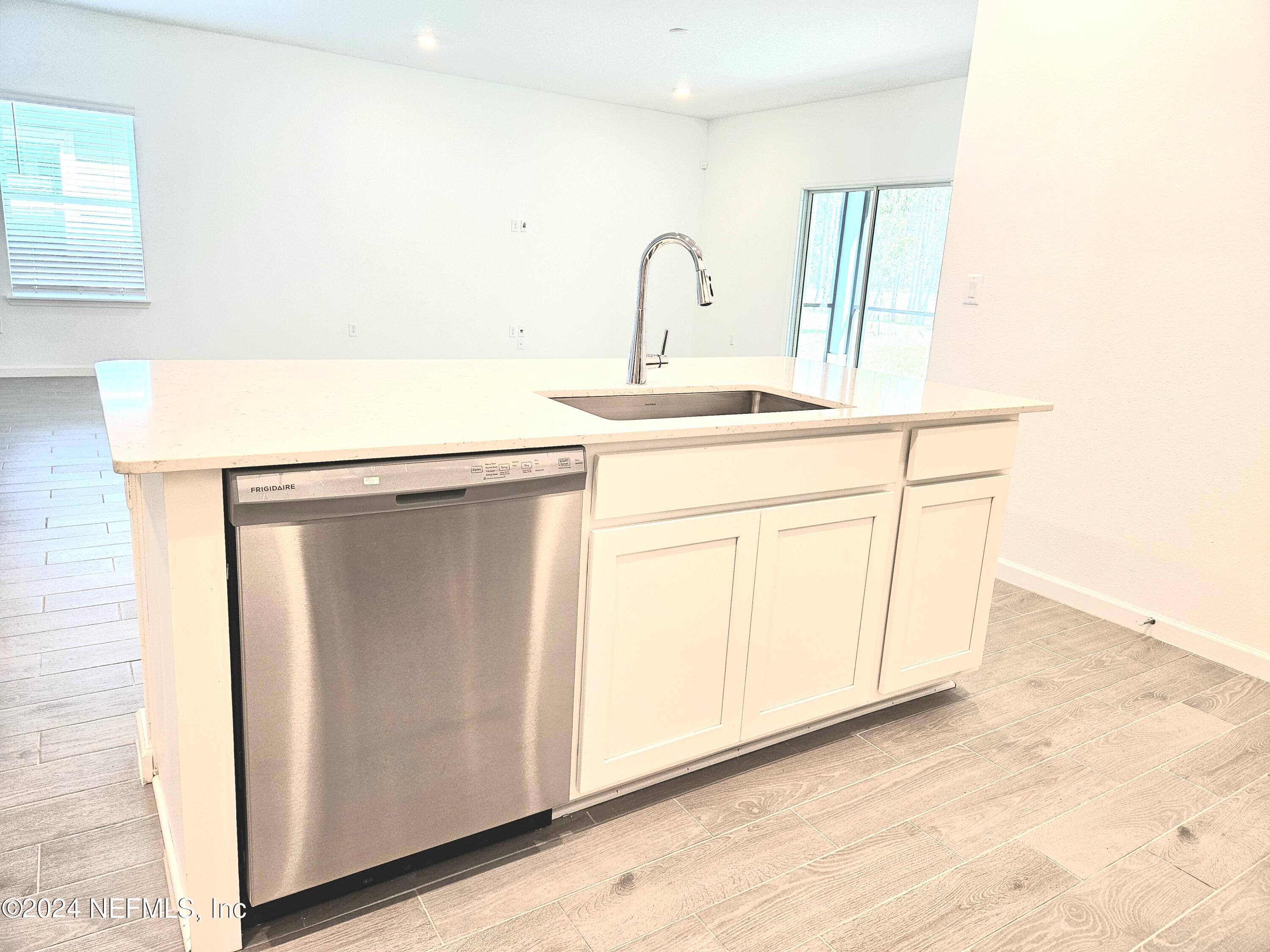 49 Blue Cypress Trail St. Augustine, FL 32084 - Photo 7 of 23 a close view of a sink a faucet and a cabinet in a bathroom