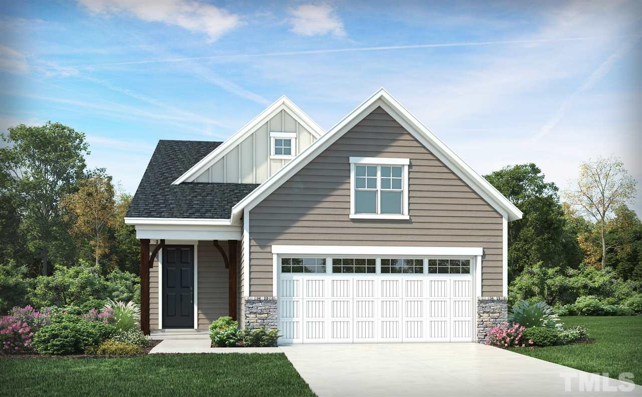 256 Mahogany Run, Unit 190 Raleigh, NC 27610 - Photo 1 of 2 a front view of a house with a yard and garage