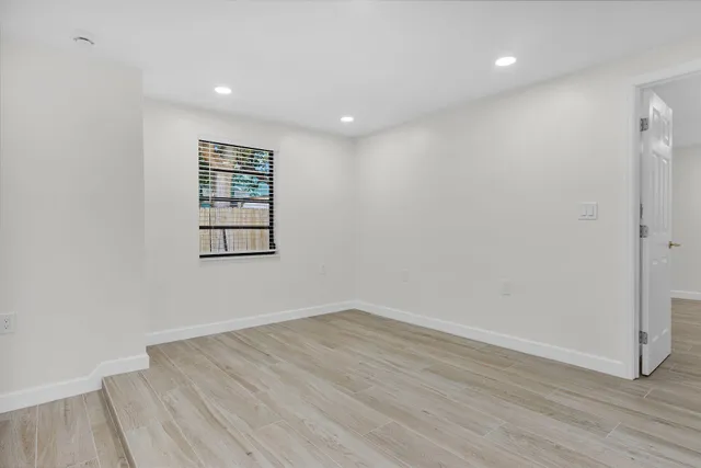 a kitchen with stainless steel appliances a refrigerator sink and microwave