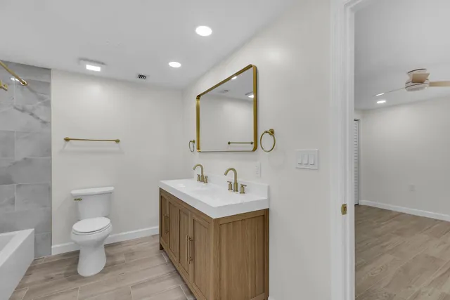 a bathroom with a shower and a toilet