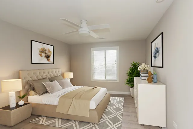 a bed room with a bed and a chair