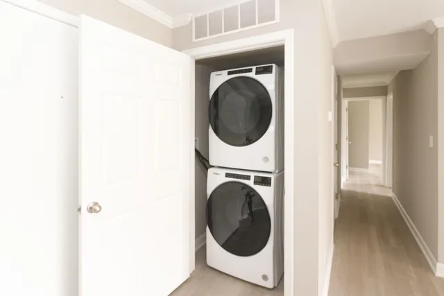 a view of a hallway with washer and dryer