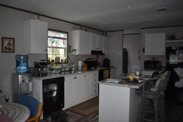 a room with furniture and wooden floor