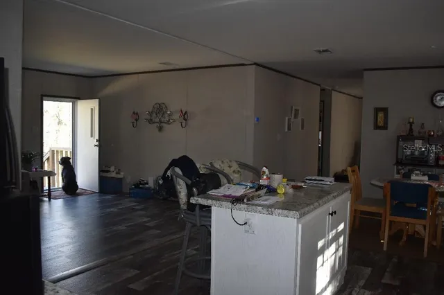 a view of a house with a yard and stairs