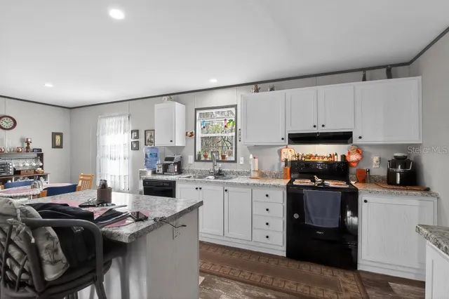 a view of a yard with wooden fence