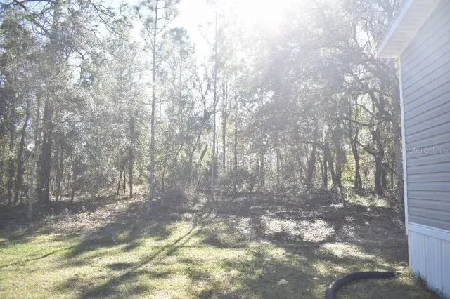 a bedroom with a bed and a mirror