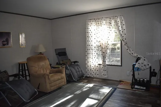 a room with furniture and a flat screen tv