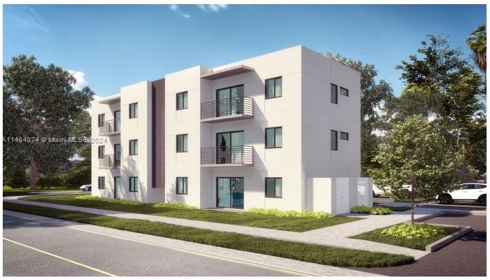 3095 Northwest 26th Street Miami, FL 33142 - Photo 1 of 4 a front view of a building with garden