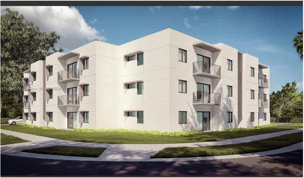 a view of a building with a yard