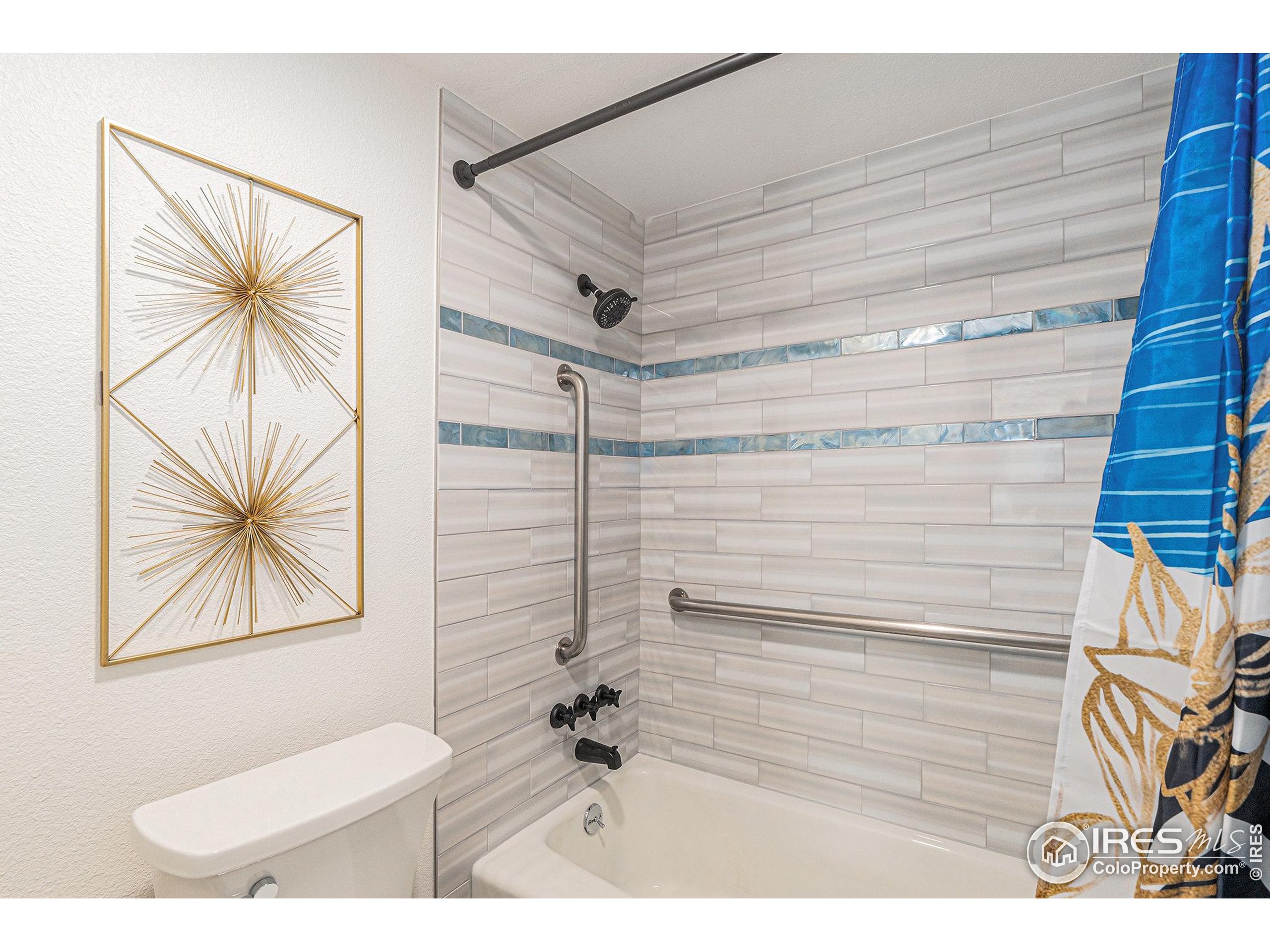 620 Mathews Street, Unit 104 Fort Collins, CO 80524 - Photo 13 of 32 a bathroom with a sink a toilet and a shower