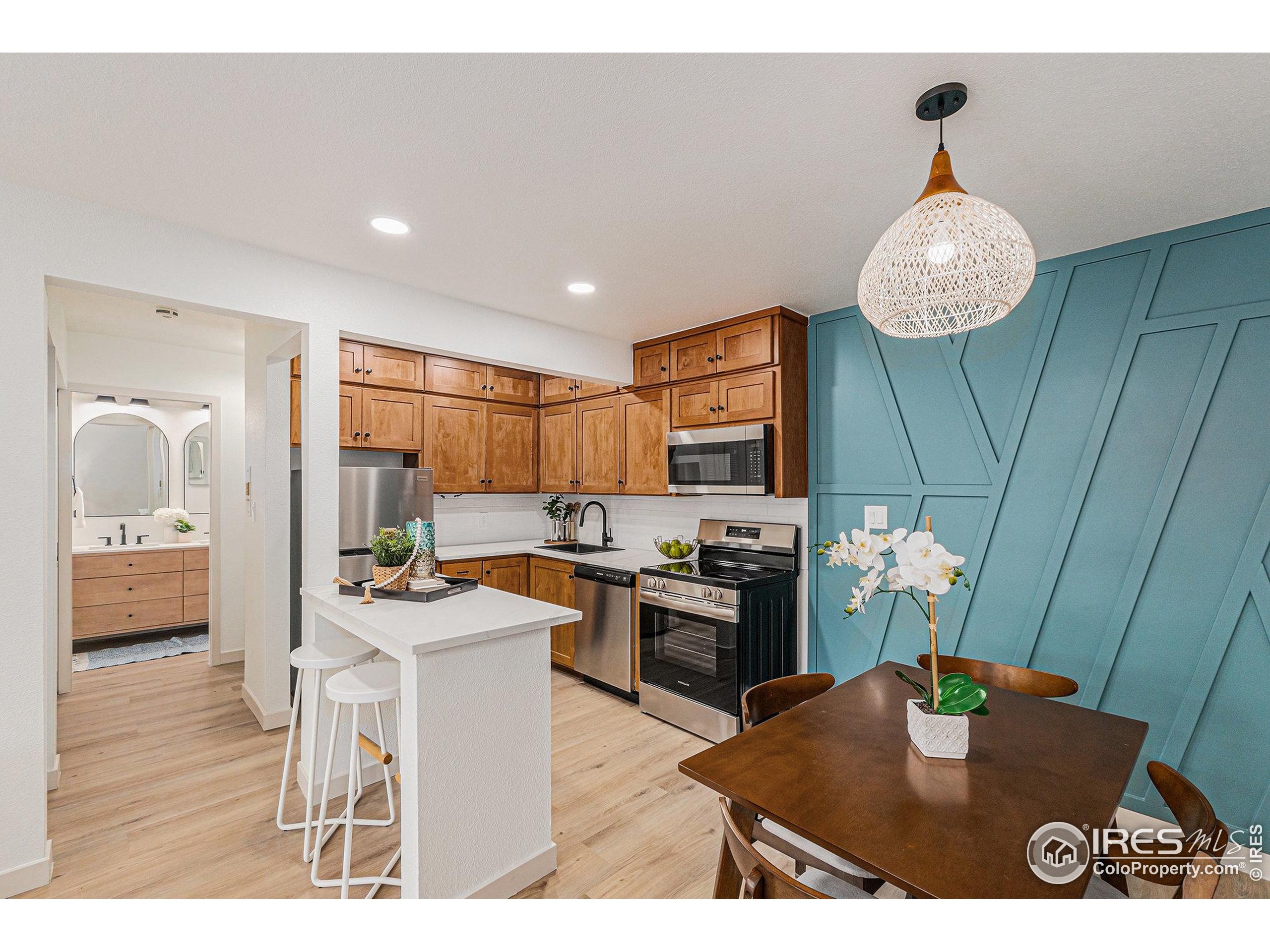 620 Mathews Street, Unit 104 Fort Collins, CO 80524 - Photo 14 of 32 a kitchen with a table and chairs in it