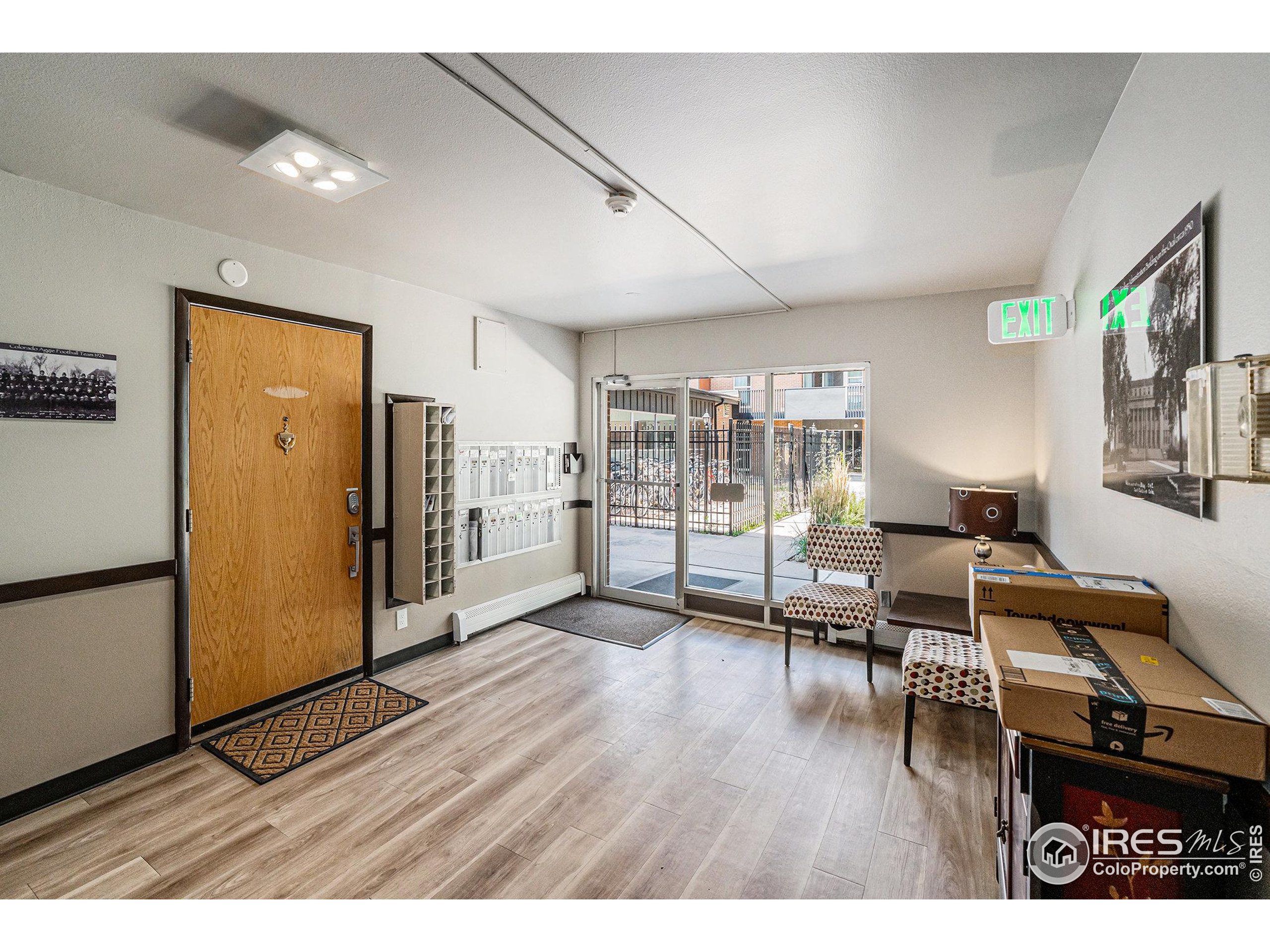 620 Mathews Street, Unit 104 Fort Collins, CO 80524 - Photo 20 of 32 a living room with furniture and a wooden floor