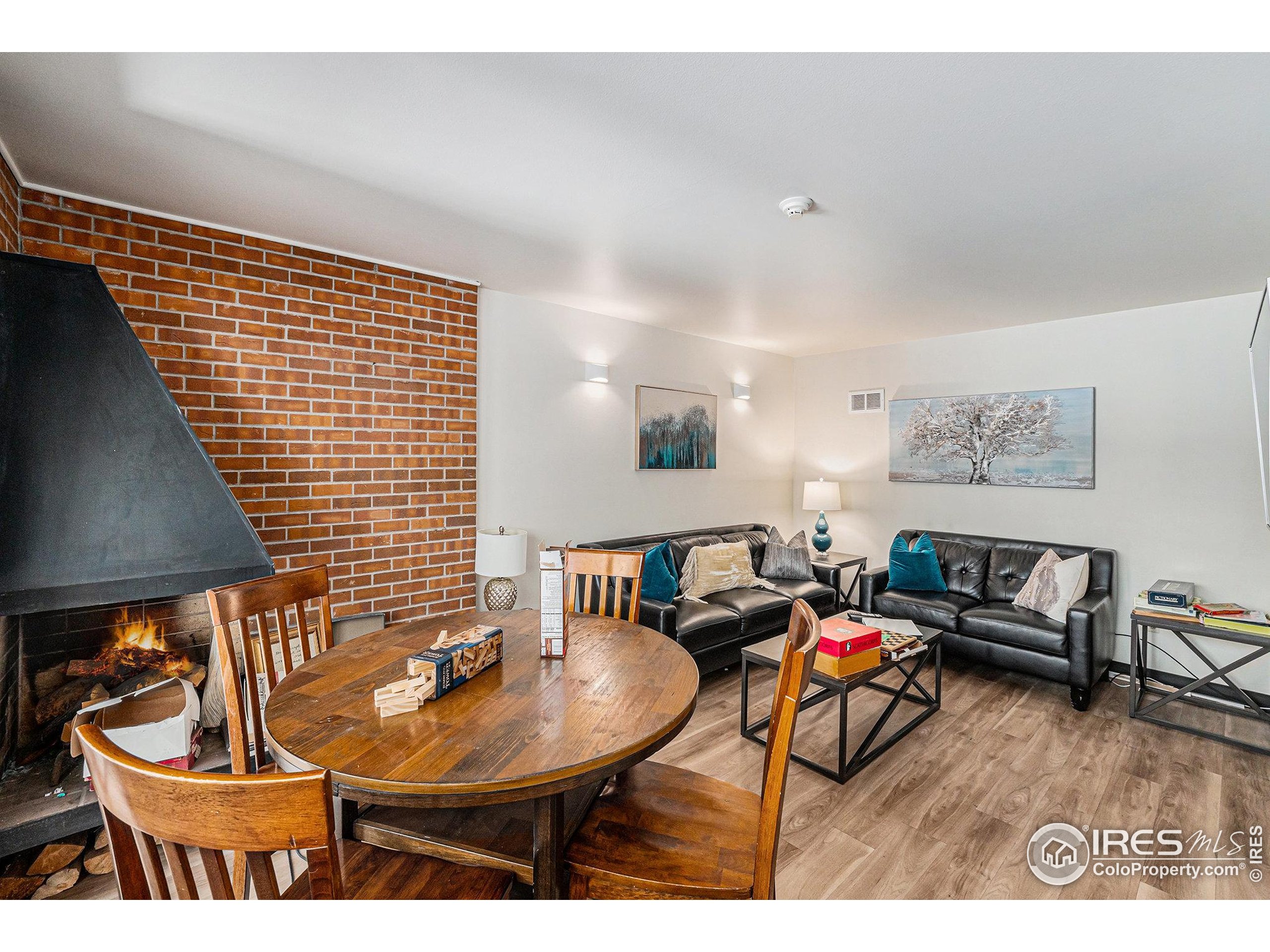 620 Mathews Street, Unit 104 Fort Collins, CO 80524 - Photo 22 of 32 a living room with furniture and a lamp