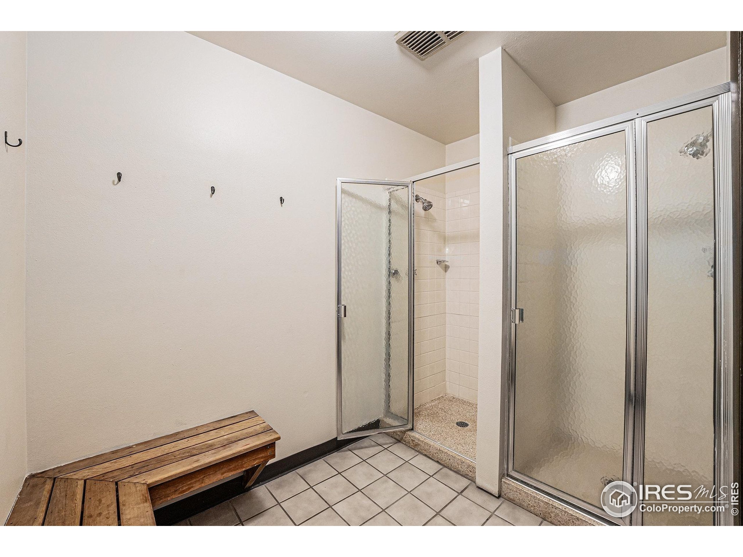 620 Mathews Street, Unit 104 Fort Collins, CO 80524 - Photo 25 of 32 a bathroom with a window and a shower