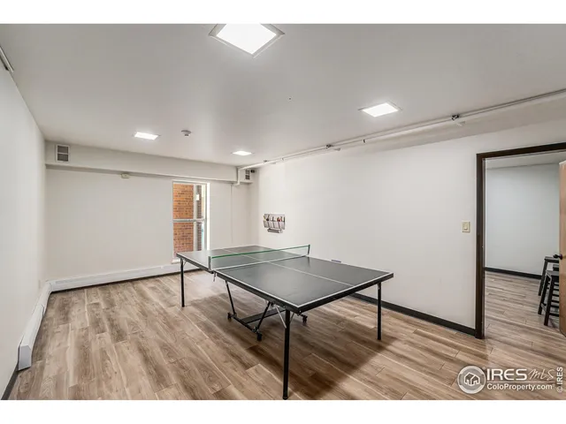 a view of a room with wooden floor and wooden floor