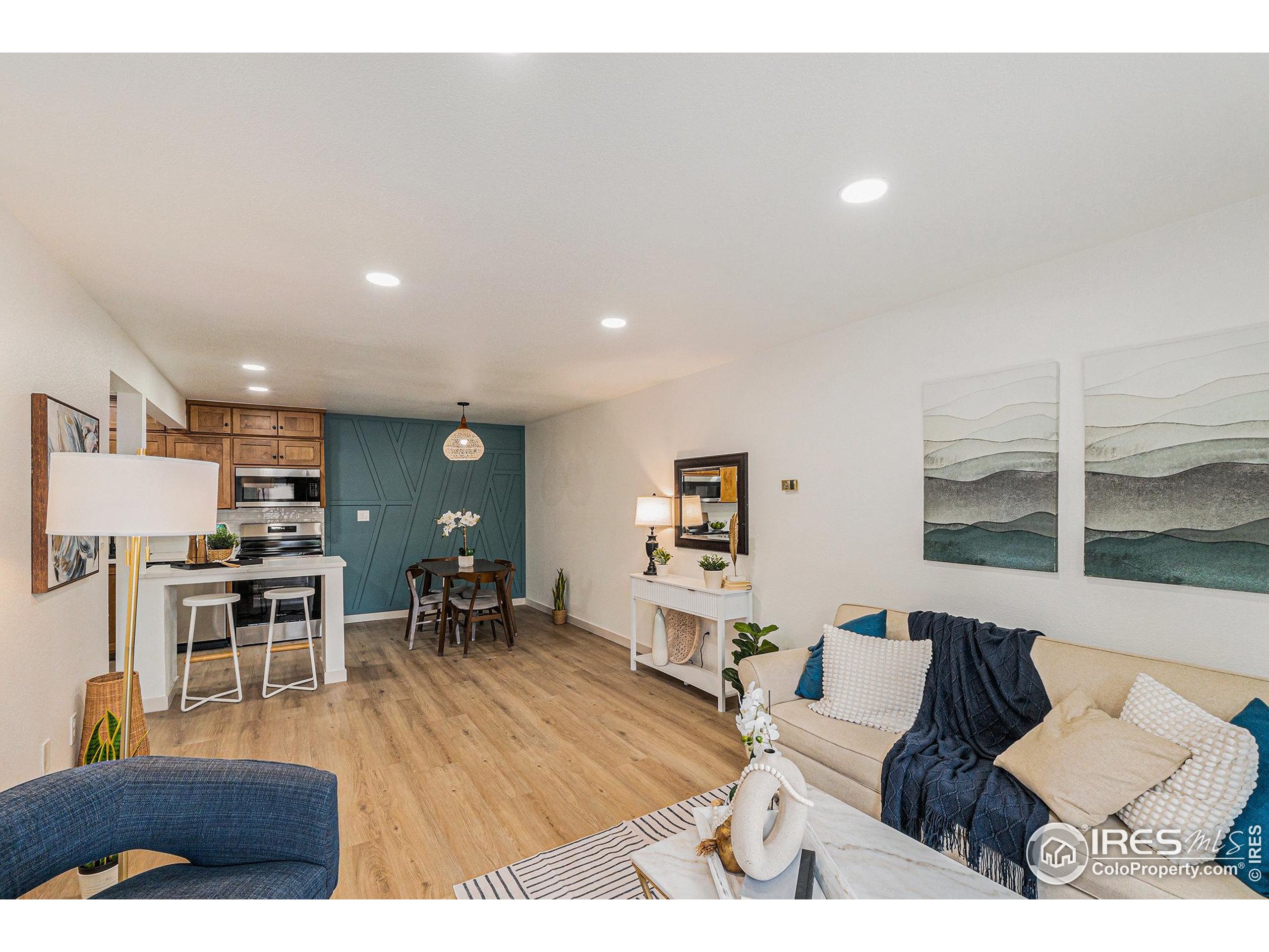 620 Mathews Street, Unit 104 Fort Collins, CO 80524 - Photo 3 of 32 a living room with furniture and a table