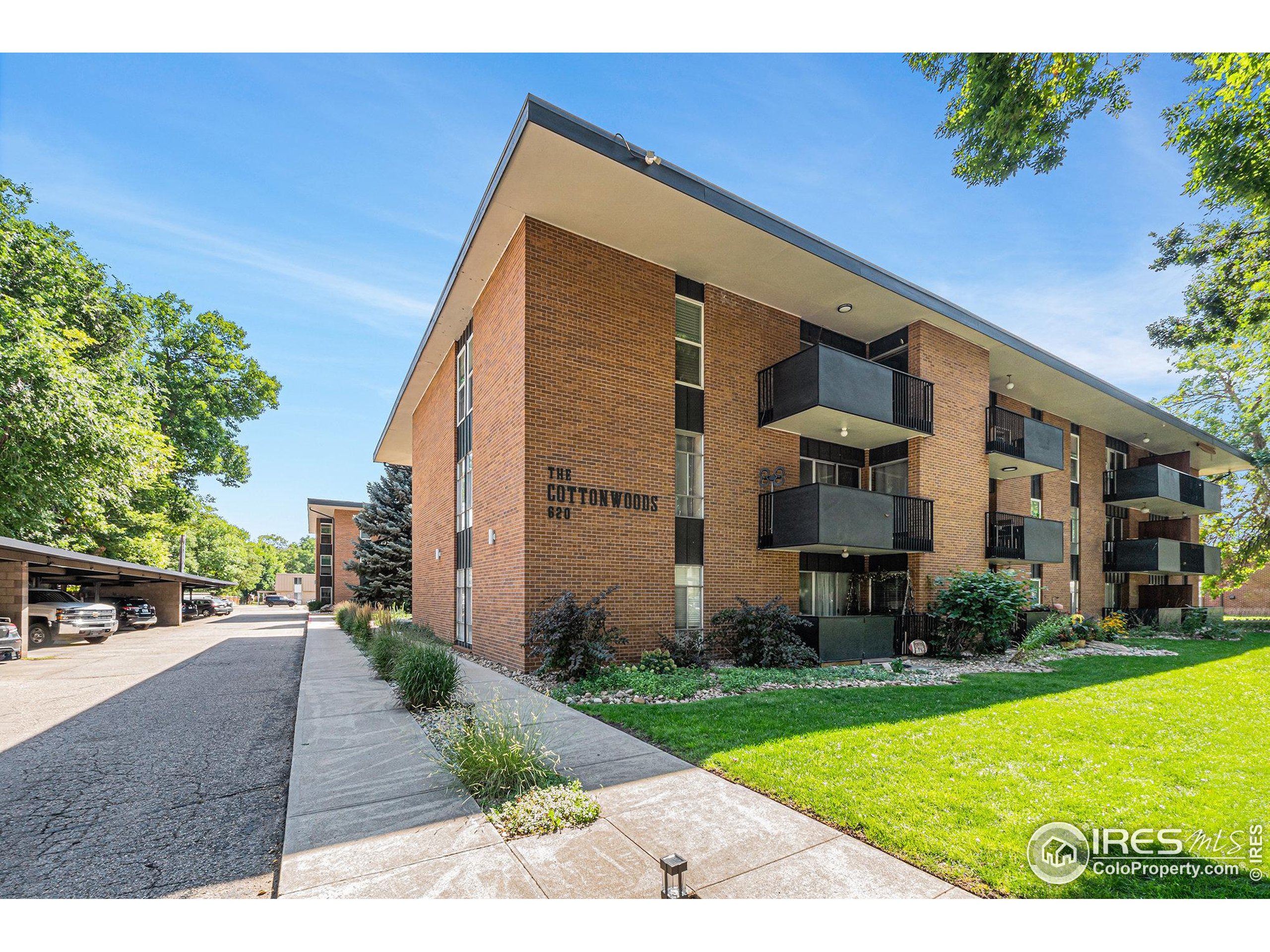 620 Mathews Street, Unit 104 Fort Collins, CO 80524 - Photo 6 of 32 a view of a house with a yard