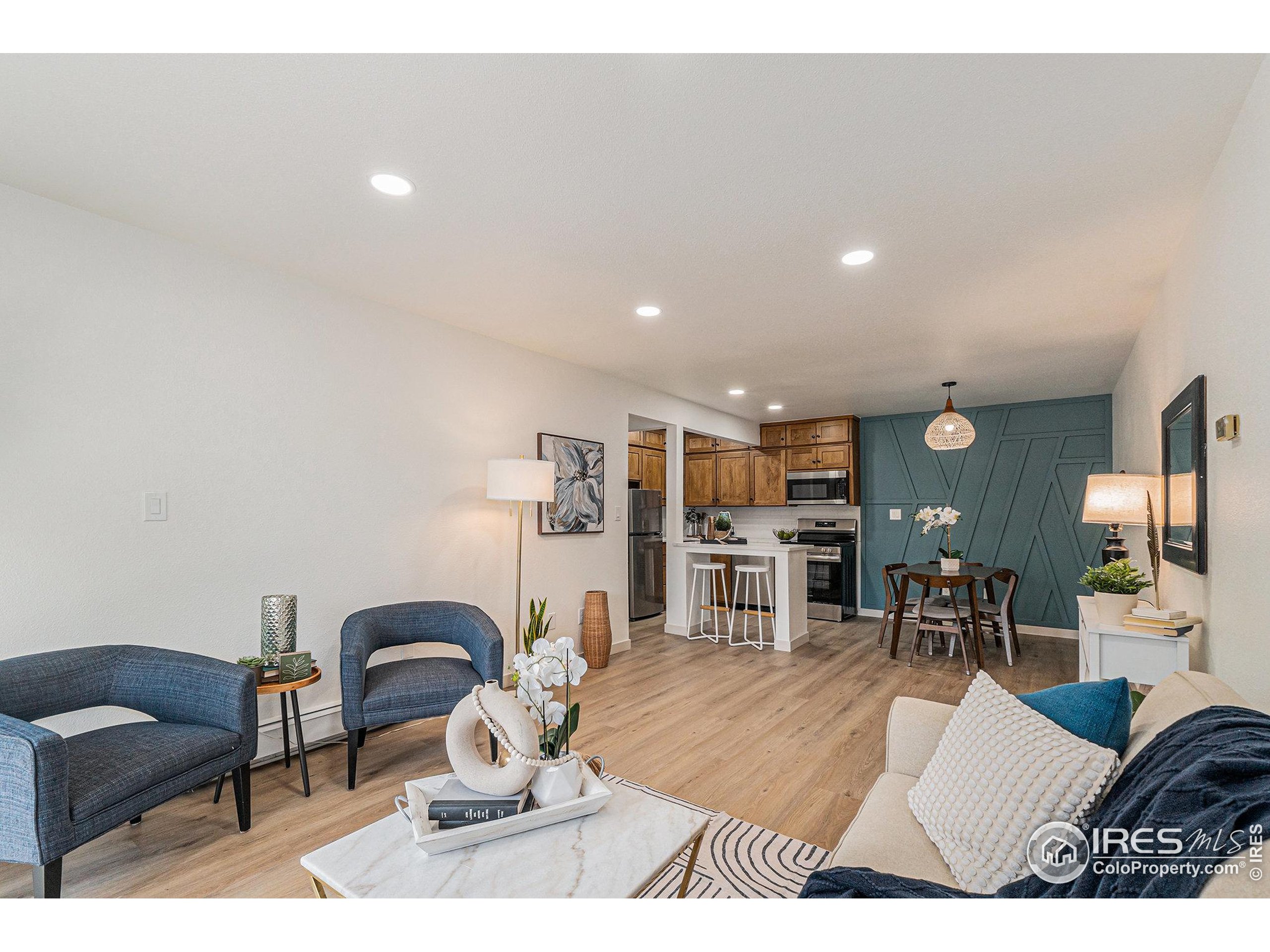 620 Mathews Street, Unit 104 Fort Collins, CO 80524 - Photo 9 of 32 a living room with furniture and wooden floor
