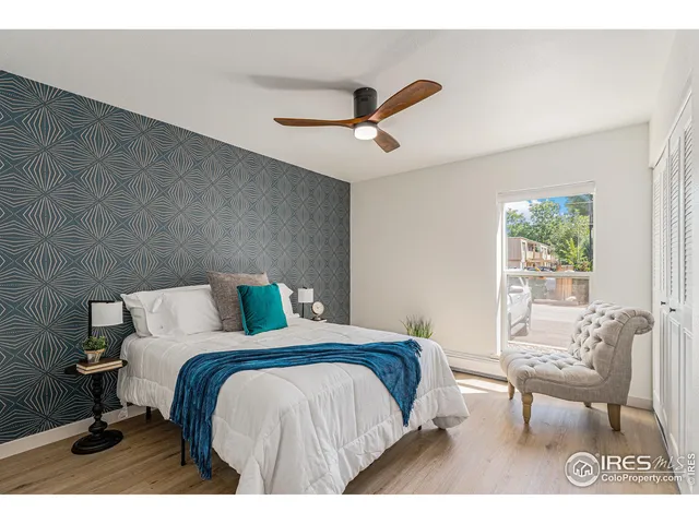 a bedroom with a bed and a chair