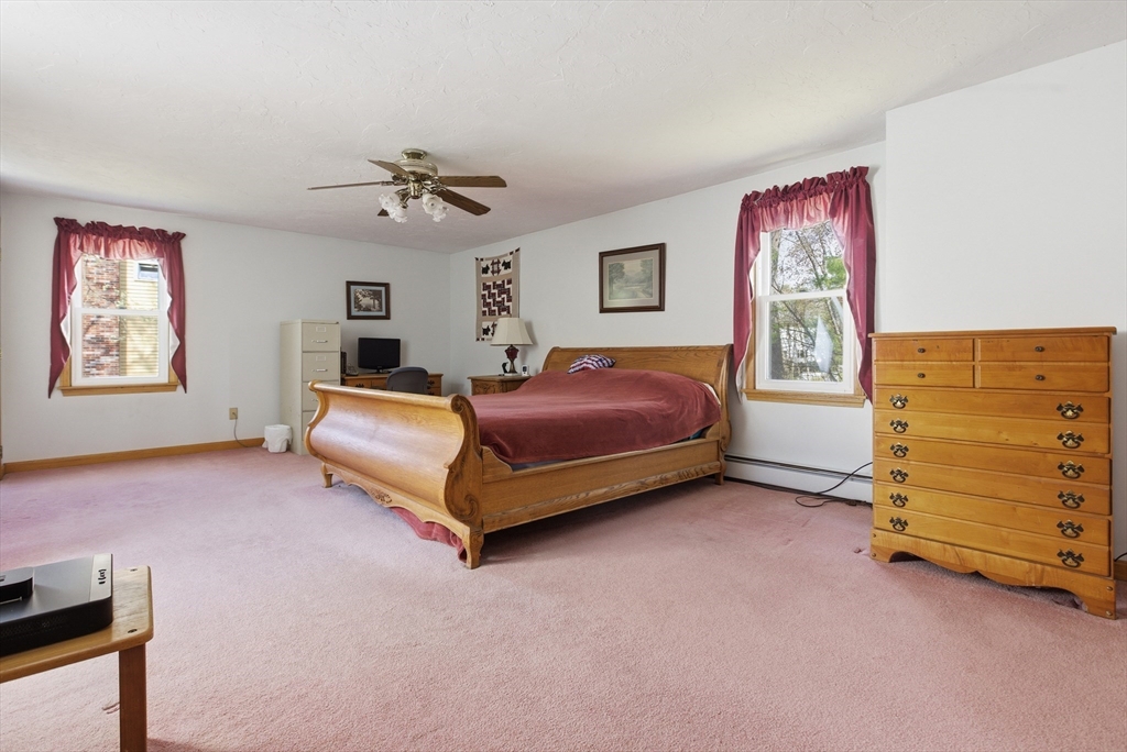 19 Mockingbird Lane Maynard, MA 01754 - Photo 20 of 34 a spacious bedroom with a bed and a window