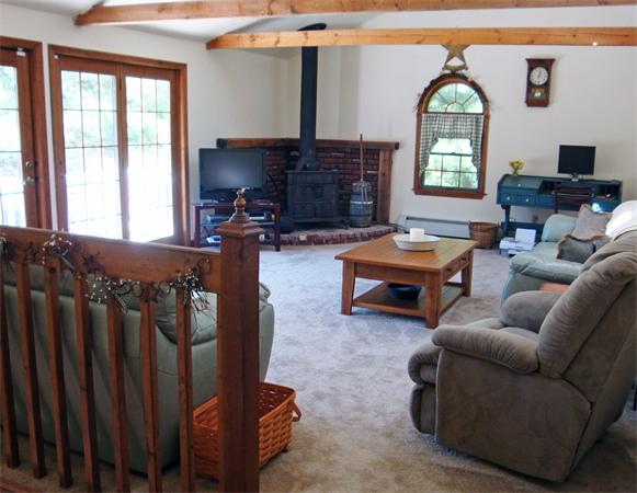 37 Johnson Road Sutton, MA 01590 - Photo 16 of 25 a living room with furniture and a large window