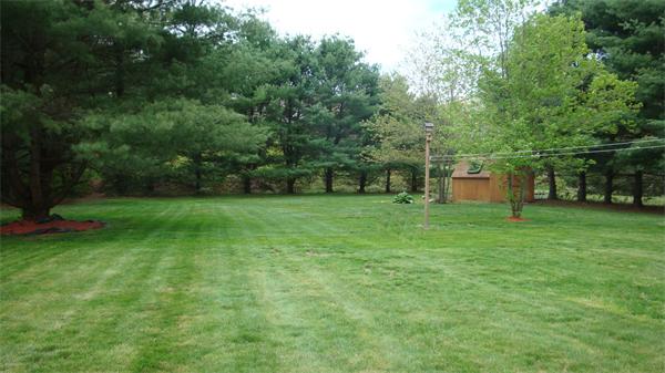 37 Johnson Road Sutton, MA 01590 - Photo 8 of 25 a view of a backyard with a garden