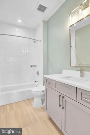 a bathroom with a sink a toilet and a bathtub