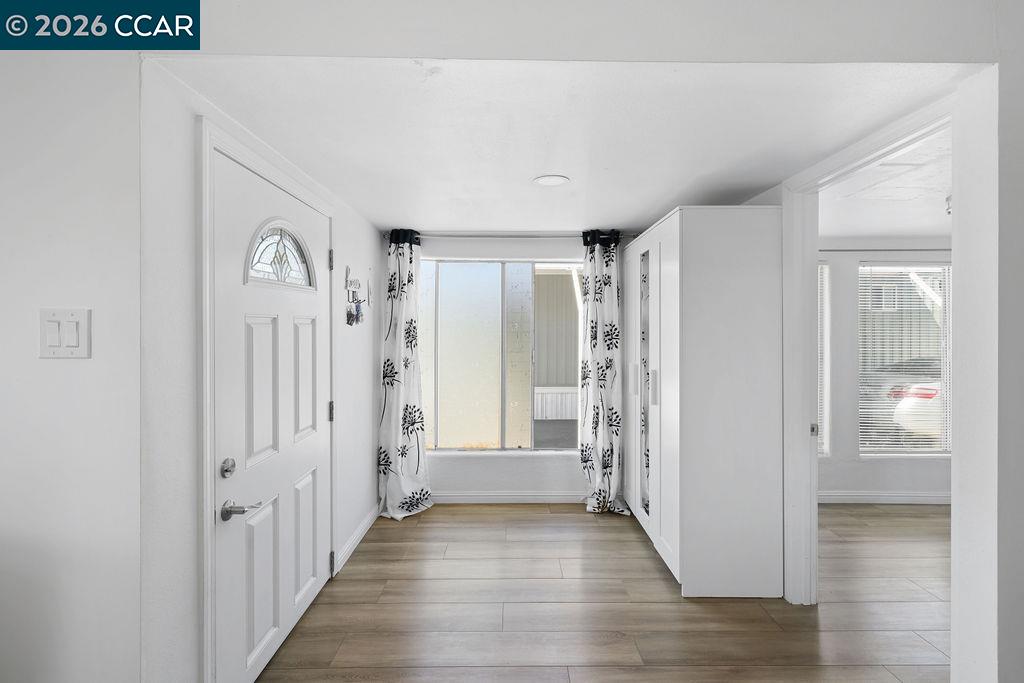 3301 Buchanan Road, Unit 85 Antioch, CA 94509 - Photo 6 of 26 a view of a hallway with wooden floor and staircase