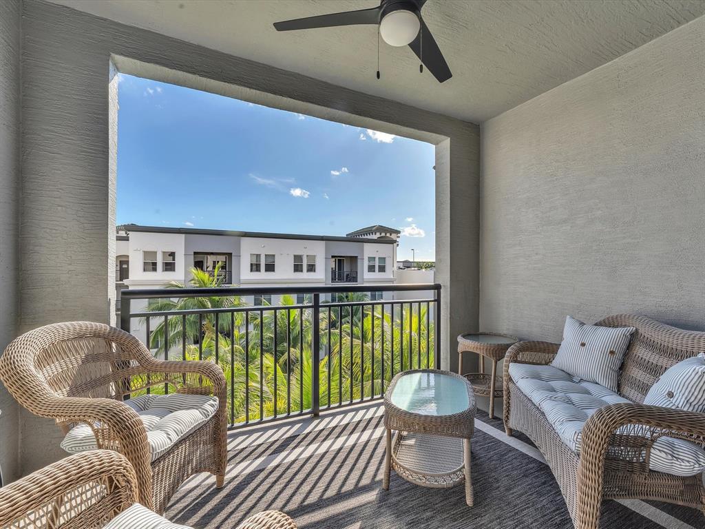 1660 Renaissance Commons Boulevard, Unit 2628 Boynton Beach, FL 33426 - Photo 14 of 49 a living room with furniture and a window