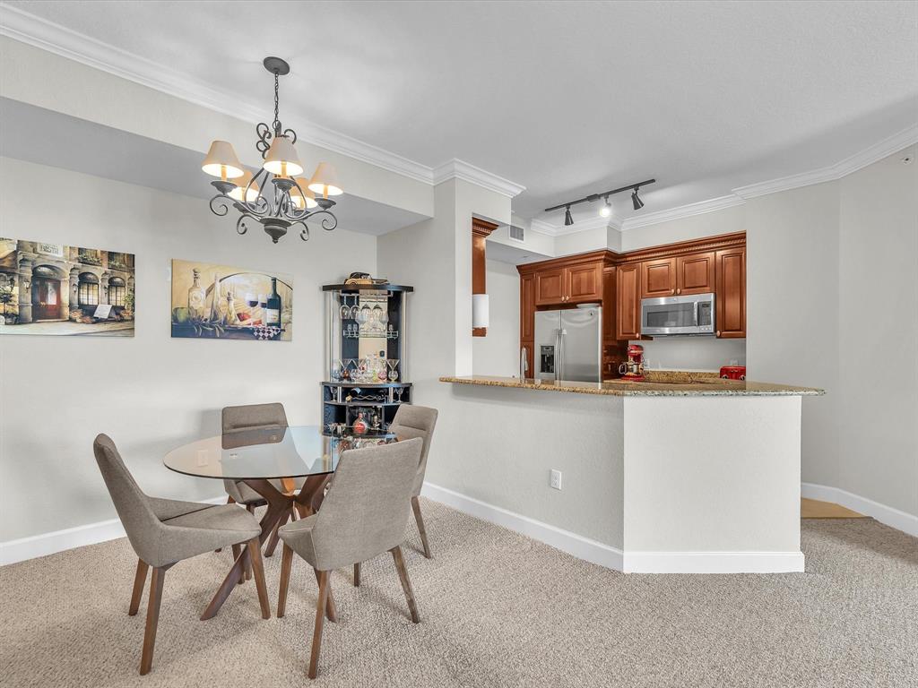 1660 Renaissance Commons Boulevard, Unit 2628 Boynton Beach, FL 33426 - Photo 20 of 49 a dining room with furniture a chandelier and window